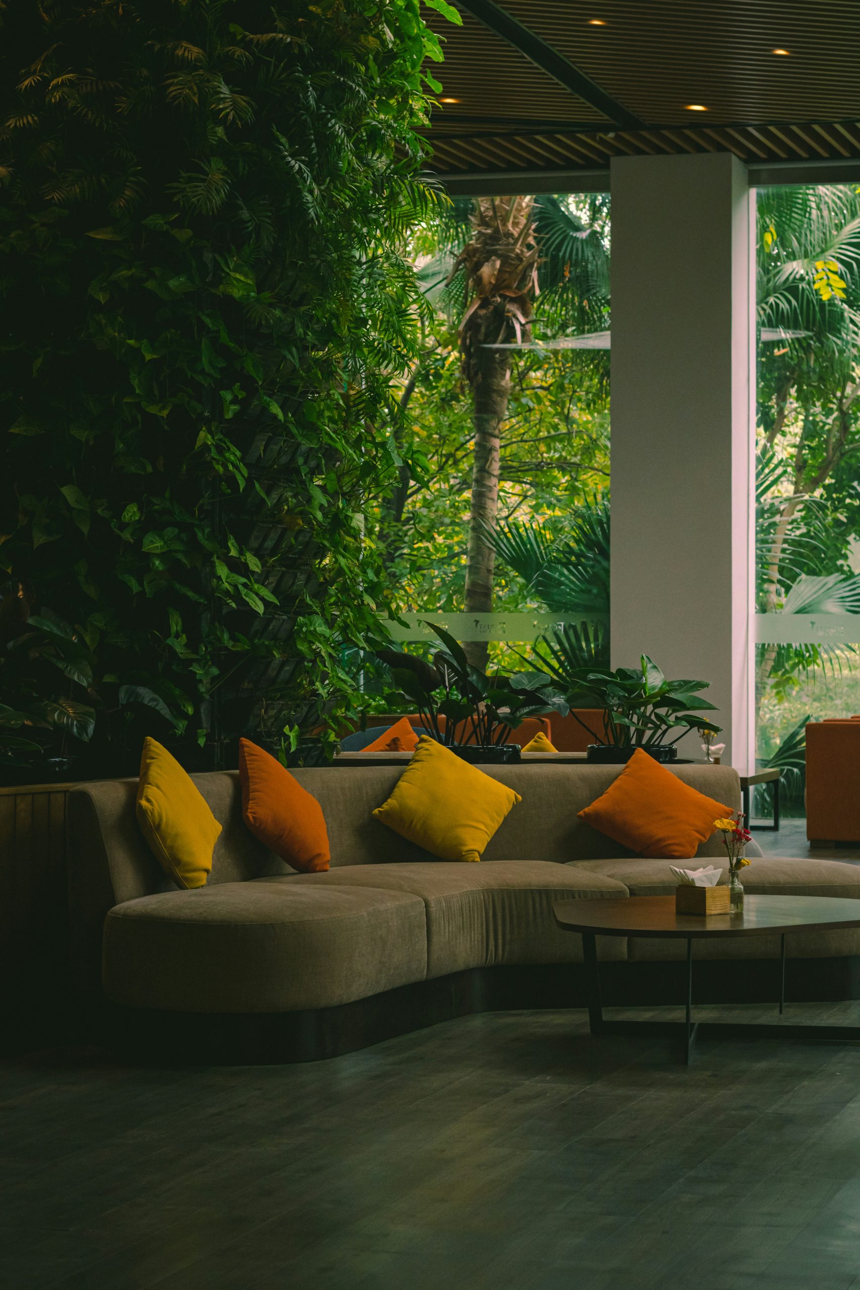Indoor Jungle Living Room with Large Concrete Planter and Soft Neutrals